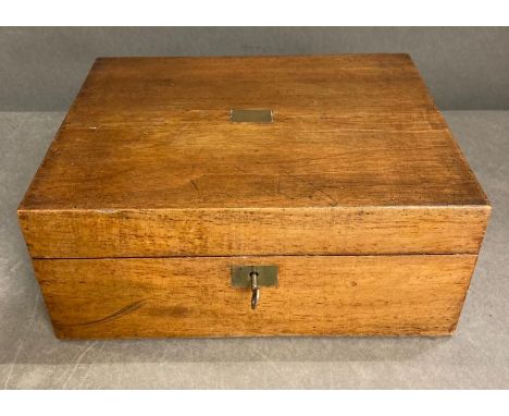 A light oak writing box with inkwell with brass lid and a selection of quells 