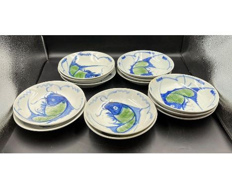 Thirteen ceramic bowls with carp/fish decoration stamp to base 