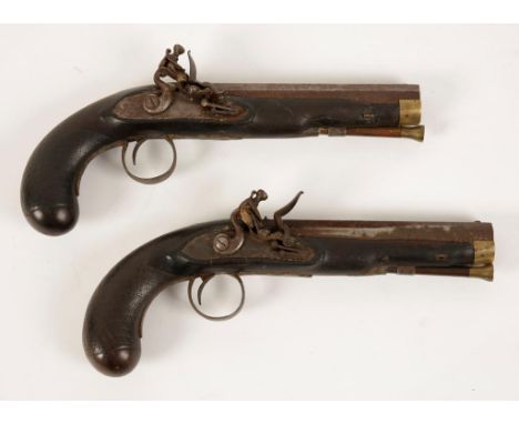 A PAIR OF FLINTLOCK PISTOLS, the steel side plate engraved "Clark", the grip with carved patch and cross decoration, 19th cen