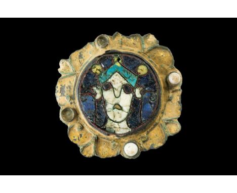AN ANGLO-SAXON ENAMEL AND GILT METAL BROOCH, the enamel roundel in four colours, probably the head of a King, the gilt metal 