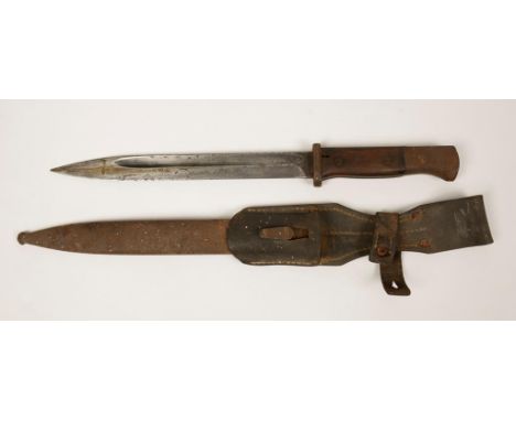 A FIRST WORLD WAR BAYONET with scabbard and original leather frog, 40cm.