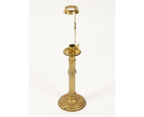 A BRASS CAMPAIGN FOLDING CANDLESTICK, 19th century, 29cm high excluding clip mount. Provenance: Peter Bronson Collection.