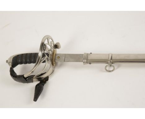 A VICTORIAN INFANTRY OFFICERS SWORD with a steel hilt and shagreen handle, the blade with a presentation inscription "Present