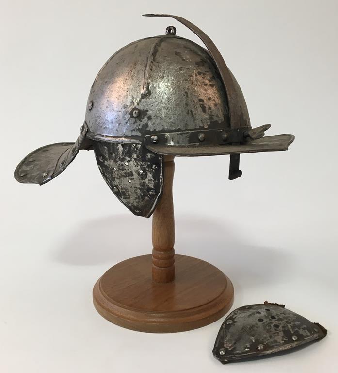 A EUROPEAN LOBSTER TAIL STEEL HELMET with a retractable nose guard, the interior with leather str