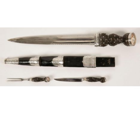 A SCOTTISH DIRK with a leather and silver-plated mounted scabbard, carved lattice-work wood grips and jewelled finials, 19th 