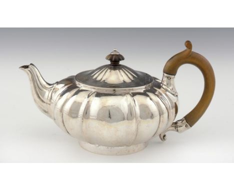 A VICTORIAN SILVER MELON SHAPED TEAPOT 13cm h, by R & S Garrard, London 1840, 20ozs 10dwts ++Minor dents and light wear