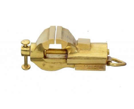 A GOLD FUNCTIONING  VICE PENDANT OR CHARM  3cm h excluding loop, marked 750, 22.6g ++Satisfactory condition with light scratc