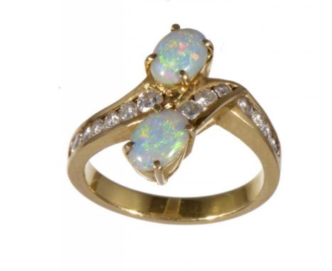 AN OPAL AND DIAMOND CROSS-OVER RING in gold, 5.7g, size M ++Satisfactory second hand condition 