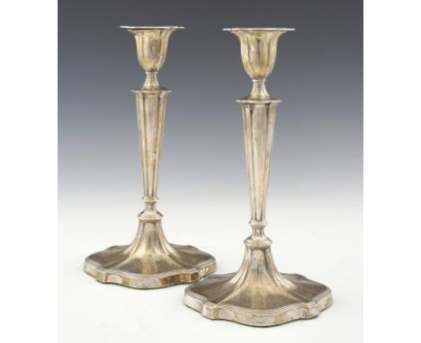 A PAIR OF EDWARD VII SILVER CANDLESTICKS with nozzles, 29cm h,  by Hawksworth, Eyre & Co Ltd, Sheffield 1905, loaded ++Minor 