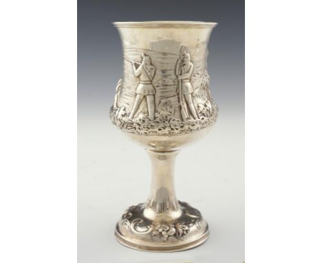 A VICTORIAN SILVER GOBLET the waisted bowl chased in high relief with three riflemen in a landscape, 20.5cm h, by Robert Harp