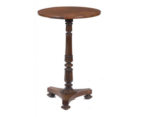 A GEORGE IV ROSEWOOD LAMP TABLE  with crossbanded top, the pillar carved with lotus, 73cm h, 48cm diam ++Restored and repolis