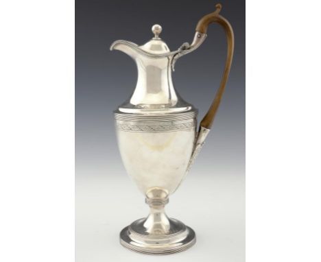 A GEORGE III NEO CLASSICAL SILVER HOT WATER JUG  with reeded rims and bright cut borders, 34cm h, mark of Thomas Ollivant of 