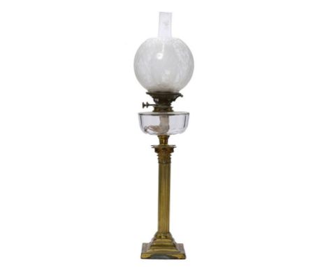 A VICTORIAN BRASS COLUMNAR OIL LAMP, C1900  with clear glass fount, brass burner and etched glass globe, 69cm h excluding chi