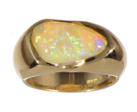 AN IRREGULAR SHAPED OPAL RING in 18ct gold, Birmingham 2001, 15g, size O ++In fine condition 