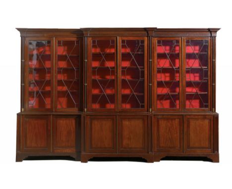 A MAHOGANY BREAKFRONT BOOKCASE, MID 19TH C  the cavetto cornice above six glazed doors enclosing adjustable shelves and divid