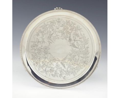 A VICTORIAN SILVER SALVER engraved with birds and blossom, on paw feet, 25.5cm diam, by Richards & Brown, London 1882, 18ozs 