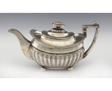 A GEORGE III SILVER TEAPOT  13cm h, by Rebecca Emes and Edward Barnard, London 1811, 18ozs 15dwts ++Typical light wear, minor