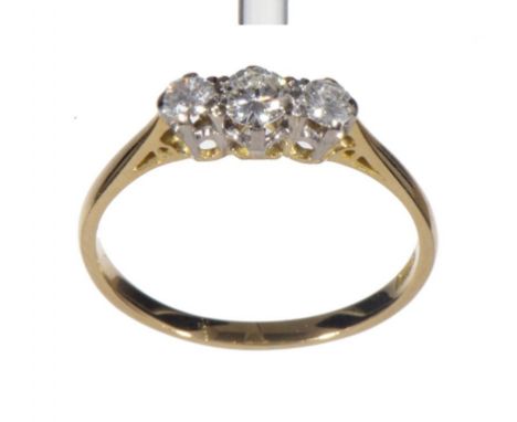 A DIAMOND RING with round brilliant cut diamonds, the largest of approximately 0.20cts, in gold, marked 18CT PLAT, 2.7g, size