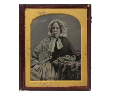 PHOTOGRAPHY.  A QUARTER PLATE AMBROTYPE OF A LADY BY JAMES THOMAS FOARD, C1855 in maroon morocco covered case with impressed 