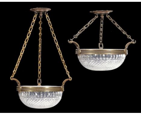 A PAIR OF CAST AND LACQUERED BRASS AND CUT GLASS HANGING LIGHTS  the heavily cut lamp bowl in guilloche frame with three loop