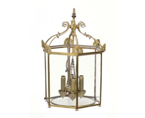AN ENGLISH BRASS HEXAGONAL HALL LANTERN, MID 20TH C applied with pierced brass anthemia, central four light pendant, 61cm h P