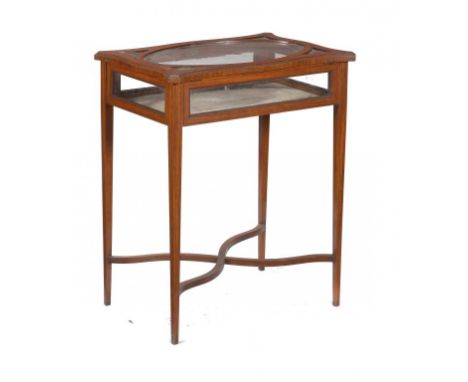 AN EDWARD VII SERPENTINE SATINWOOD AND LINE INLAID DISPLAY TABLE, C1905 76cm h; 42 x 62cm ++Some minor lifting of the veneers