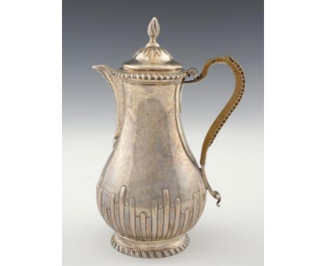 A GEORGE III SILVER HOT WATER JUG  with gadrooned rims, 23cm h, maker DW in script, probably David Whyte [Grimwade 3525], Lon