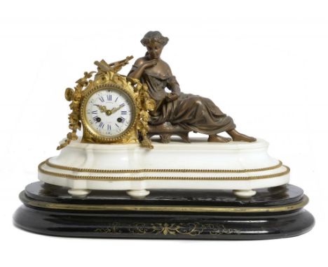 A FRENCH GILT AND BRONZED SPELTER MANTLE CLOCK, C1880 in the form of a classical maiden seated beside the swagged drum cased 