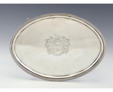 A GEORGE III OVAL SILVER SALVER with reeded rim and feet, engraved with armorials, 31cm w, by Timothy Renou, London 1798, 22o