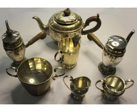 George V silver three piece tea service, Birmingham 1927 (pot lid dented) and two silver bachelors coffee pots with matching 