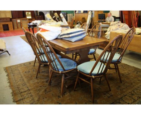 Ercol Dining Table and 8 Swan Back Chairs