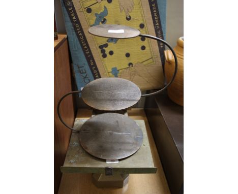 Grocers scales and two bell weights and cake stand