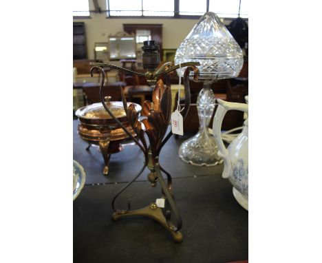 Brass and copper lamp base in the style of benson