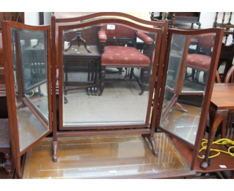 An Edwardian mahogany triptych dressing table mirror with brass vase finials