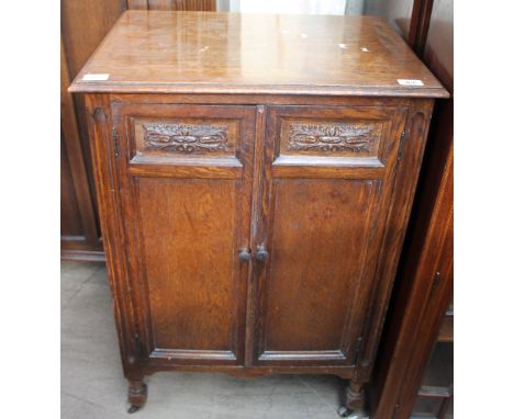 A 20th century oak music cabinet 