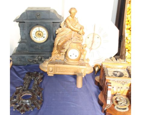A black slate mantle clock of architectural form, together with a spelter mantle clock, a painted wall clock, a modern wall c