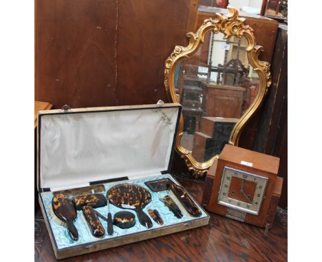 A Faux tortoiseshell cased dressing table set together with a gilt wall mirror and a walnut mantle clock