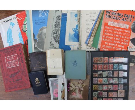 A stamp album containing World Stamps including Penny Reds, Two Pence blue, Canadian stamps, Bermuda, Hong Kong, etc, togethe