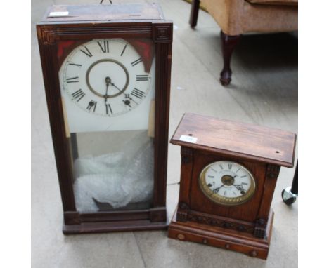 An oak mantle clock together with a wall clock