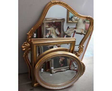 A large gilt wall mirror together with three other gilt wall mirrors