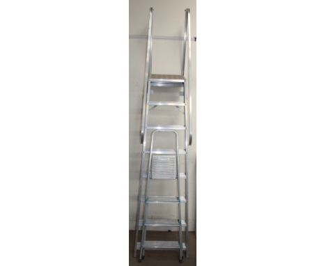 An aluminium ladder together with aluminium steps