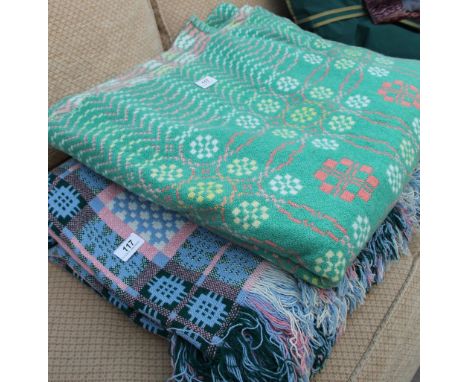 A light blue Welsh blanket together with another blanket