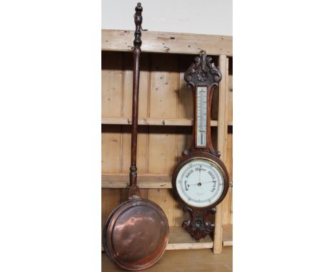 A oak cased aneroid barometer with a mercury thermometer together with a copper bed warming pan