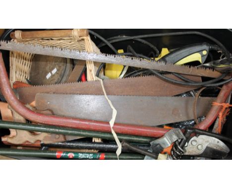 A collection of tools, hedge cutters, hammers etc