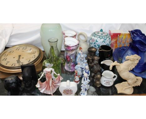 A gilt decorated wall clock together with a pottery bulldog, ebony carved head, decorative figures, jug and basin set, Toby j