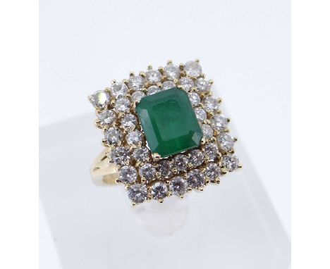 of square design, the central emerald (7 x 6.5mms) surrounded by two rows of diamonds, ring size K, 8.3gmsProvenance: decease