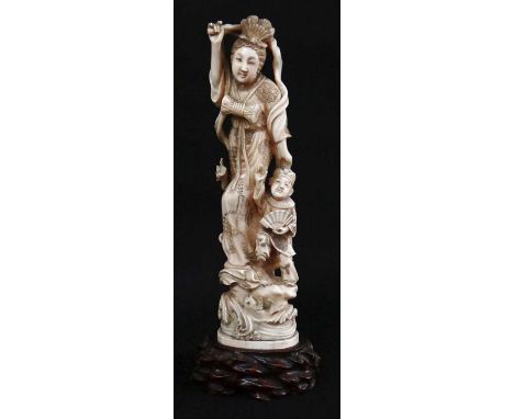 she with billowing scarf and short baton, he with fan, both standing on rockwork base with crashing waves and leaping carp, w