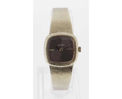 two tone dial, block batons, integrated textured 9ct gold bracelet, 31.5gms, in box with two bookletsProvenance: deceased est