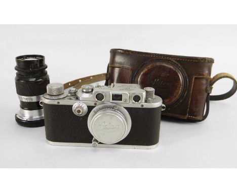 no. 323736, in chrome finish, with Elmar 1:35/50mm lens, Leitz Elmar 1:4 f=9cm lens, No. 295549, Leica lens cap, lens hood, a