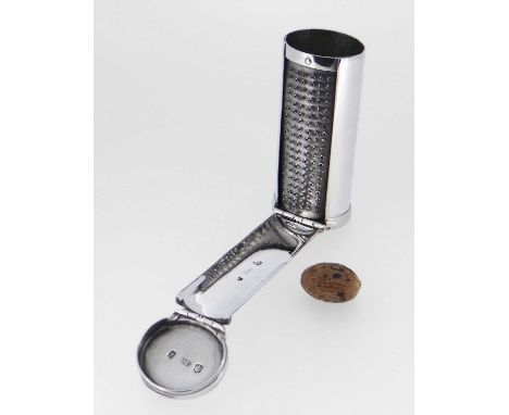 oval section, hinged and reeded cover, plain sides with a hinged panel revealing the steel grater, engraved with two crests w